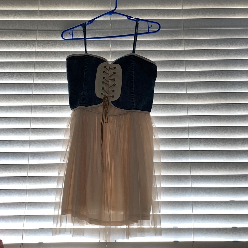 Super cute! Jean like “vest corset “ on top with a baby pink under 💗